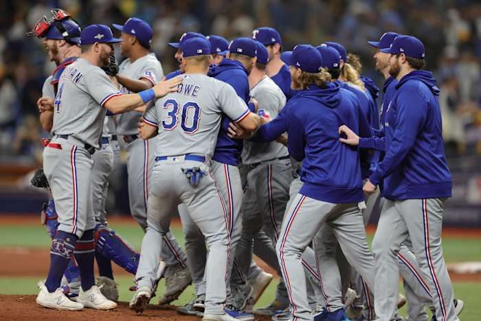 Oct 4, 2023; St. Petersburg, Florida, USA; Texas Rangers players celebrate after defeating the Tampa Bay Rays in game two of the Wildcard series for the 2023 MLB playoffs at Tropicana Field. Mandatory Credit: Nathan Ray Seebeck-USA TODAY Sports